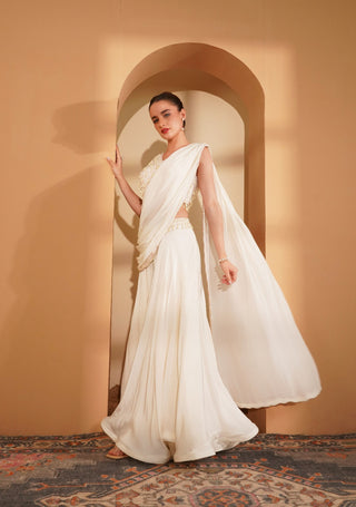 Ivory blouse with pearl accents, full flair sharara & embroidered pallu.