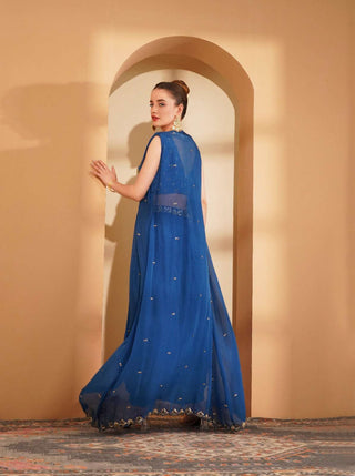 Deep blue embroidered blouse with scalloped organza cape & pleated drape skirt.