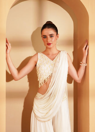 Elegant ivory crepe blouse with hanging pearls & embroidered draped pallu.