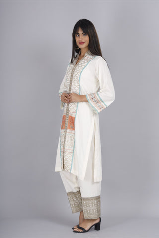 Elegant off-white cotton rayon suit with block printed v-neck kurti.