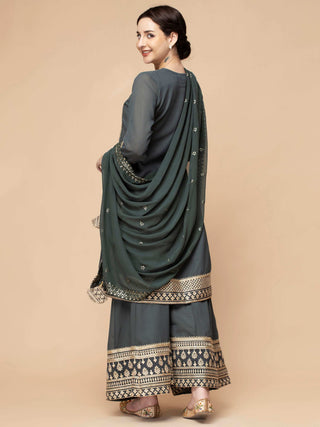 Greenish grey sharara set with zari and dori border, flair kurti.
