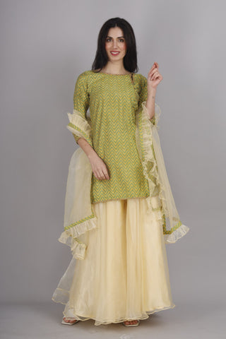 Lemon yellow organza sharara with royal kurti and dupatta.