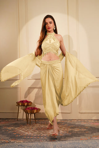 CREAM  COLOUR CREPE DRAPE SKIRT SET WITH HEAVY HAND EMBROIDERED HALTER BLOUSE AND DUPATTA
