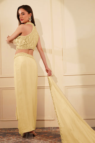 CREAM  COLOUR CREPE DRAPE SKIRT SET WITH HEAVY HAND EMBROIDERED HALTER BLOUSE AND DUPATTA