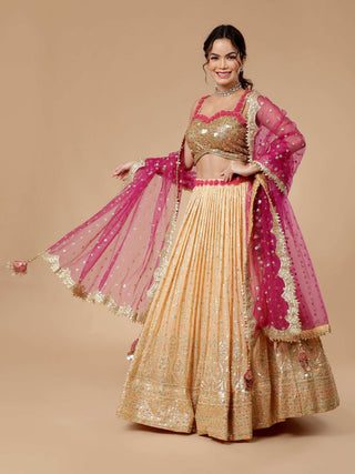 Milu Madan peach lehenga with sequin work and golden zari blouse