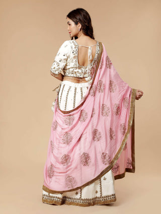Off white satin lehenga with pearl, mirror, and sequin blouse work