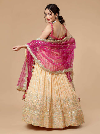 Peach lehenga with sequin thread work and hot pink bordered dupatta
