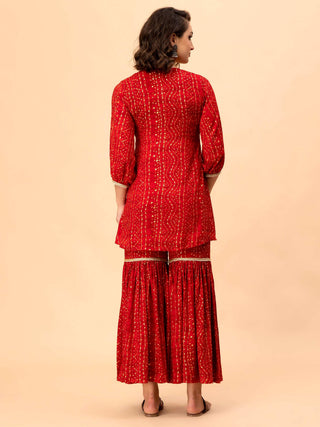 Red cotton rayon top with gathered back and Bandani sharara.