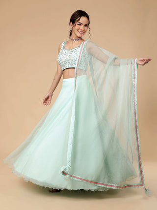 Sea foam green lehenga with floral embossed organza and sequin blouse