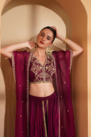 Wine crepe blouse and cape featuring pearl & mirror work, tulip pant with mirror border.
