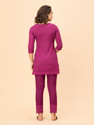 Bossy pink chikan co-ord with scallop detailing on top and pants.
