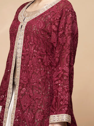 Dark maroon embroidered jacket with full-flared lehenga and strappy blouse
