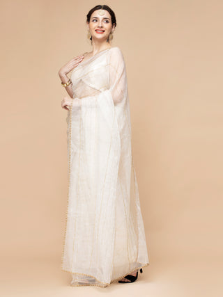 Elegant ivory organza saree with striped bead embroidery and sequined blouse.