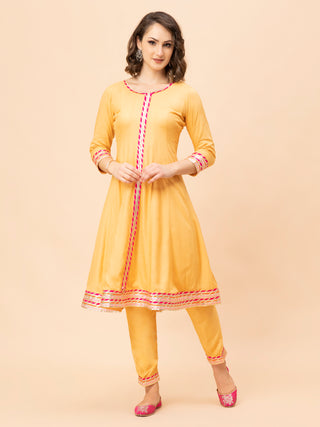 Elegant peach Anarkali with multi-colored border and hot pink dupatta