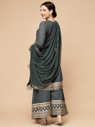Greenish grey sharara set with zari and dori border, flair kurti.