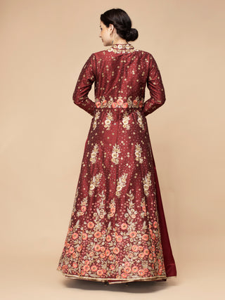 Maroon silk lehenga with heavy satin skirt and embroidered jacket.
