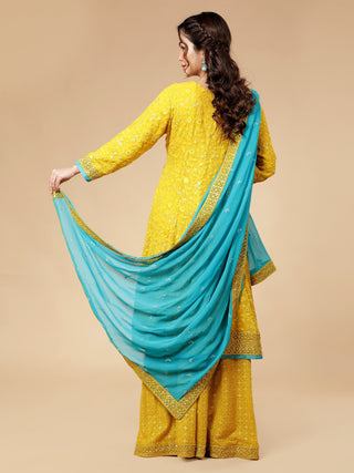 Milu Madan signature mustard yellow sharara with intricate chikankari embroidery