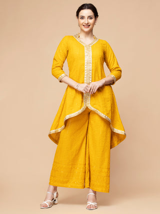 Mustard yellow chikan set with gota patti bordered kurti and plazzo.