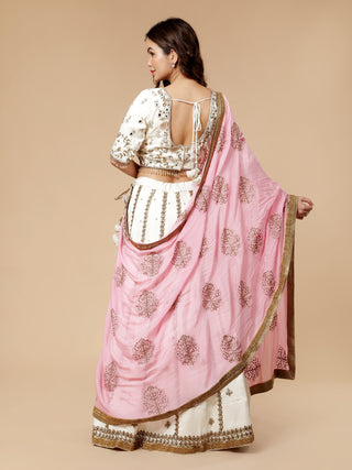 Off white satin lehenga with pearl, mirror, and sequin blouse work