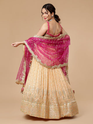 Peach lehenga with sequin thread work and hot pink bordered dupatta