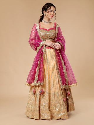 Peach sequinned lehenga with intricate thread and zari blouse work