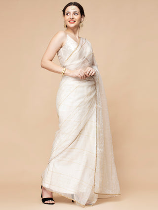 Pure ivory organza saree with bead-embroidered wrap and satin petticoat.