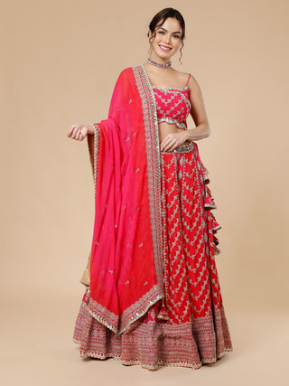 Red and hot pink lehenga set with intricate zari and mirror work