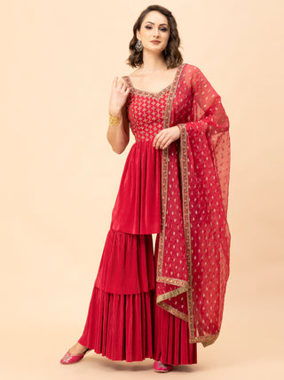 Reddish pink pleated sharara set with zari embroidery and pleated top.