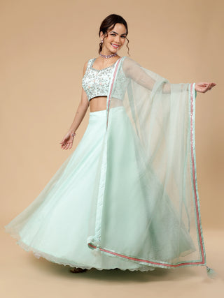 Sea foam green lehenga with floral embossed organza and sequin blouse