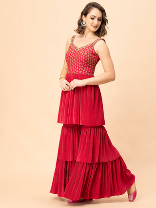 Strappy peplum top with zari embroidery and pleated sharara set.